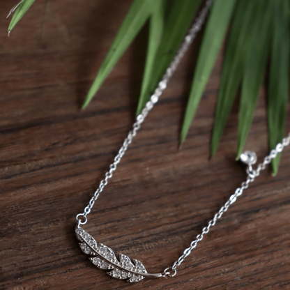 Feather cross necklace