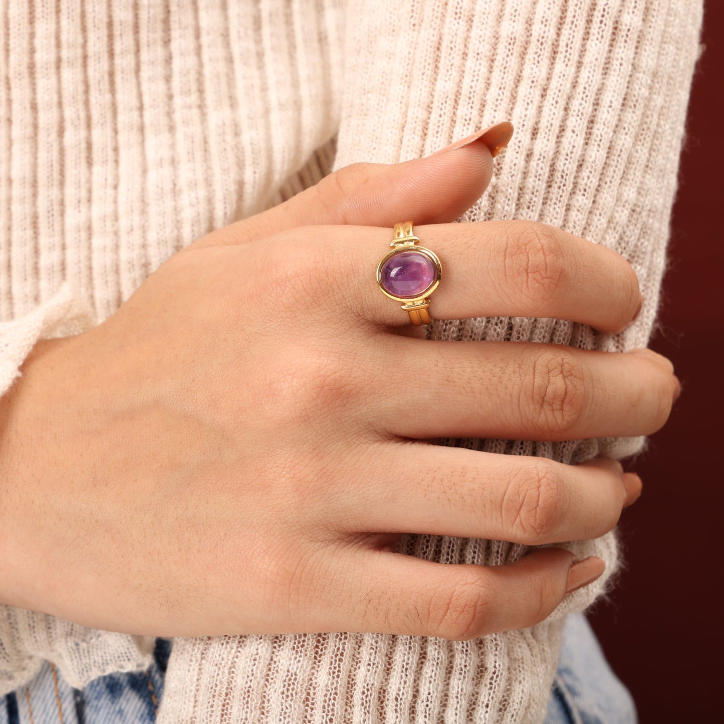 Caged golden purple ring